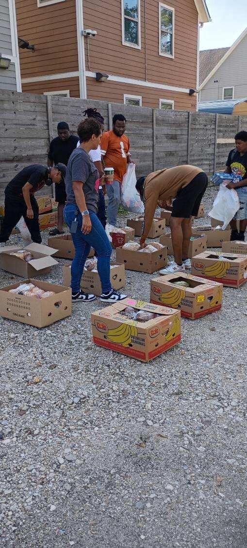 Volunteers working together to sort donations
